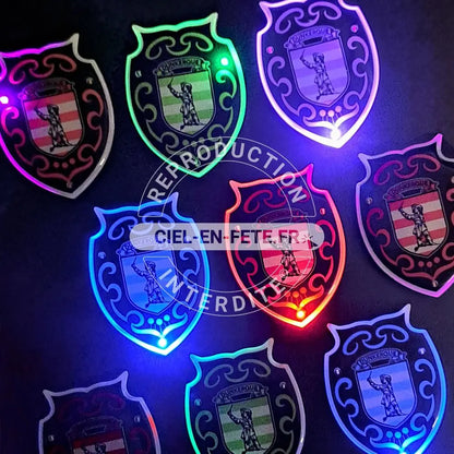 Pin's Lumineux "Blason JBRayé Violet" (4,1x5,5 cm)